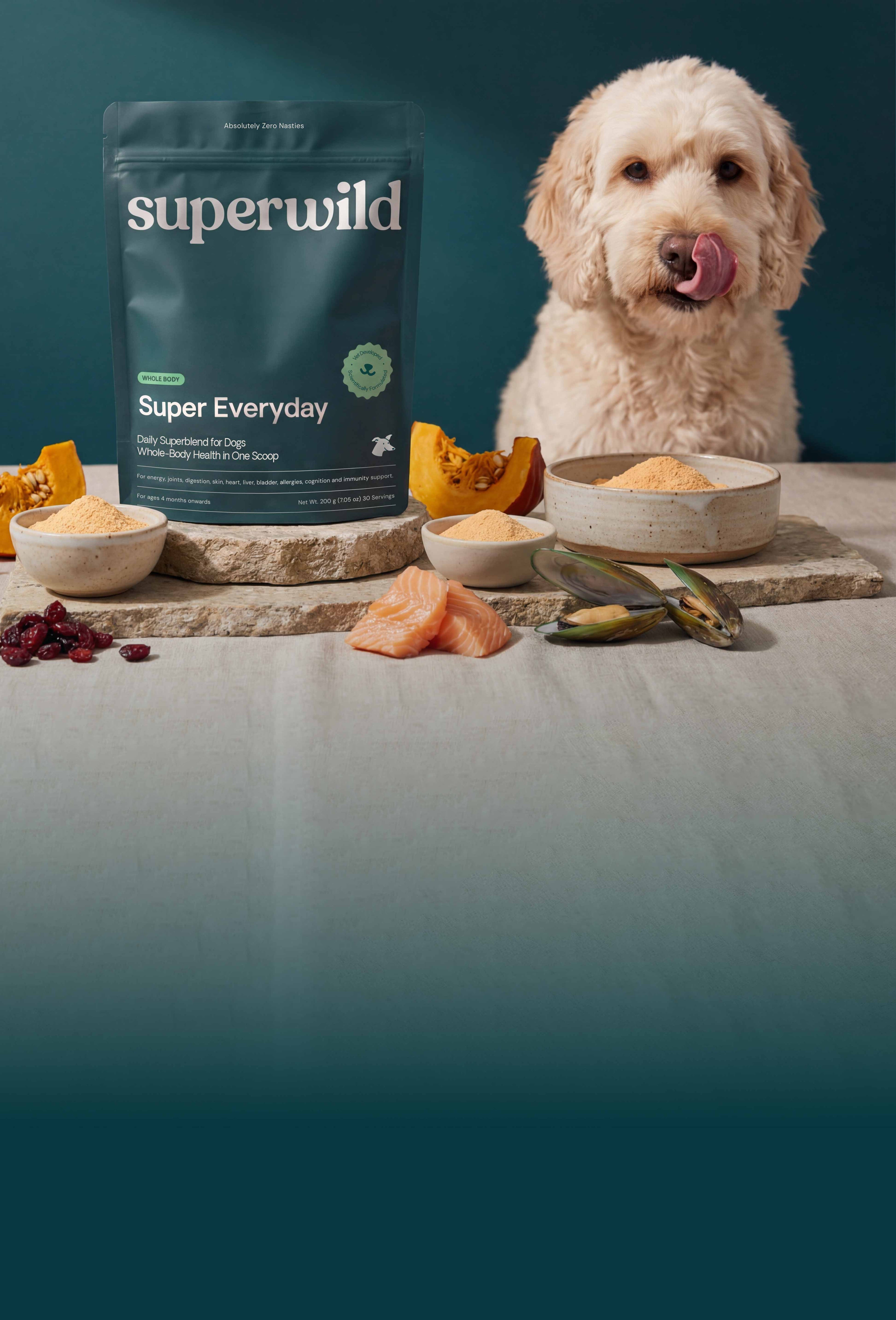 Superwild Super Everyday supplement powder surrounded by natural ingredients on dark background